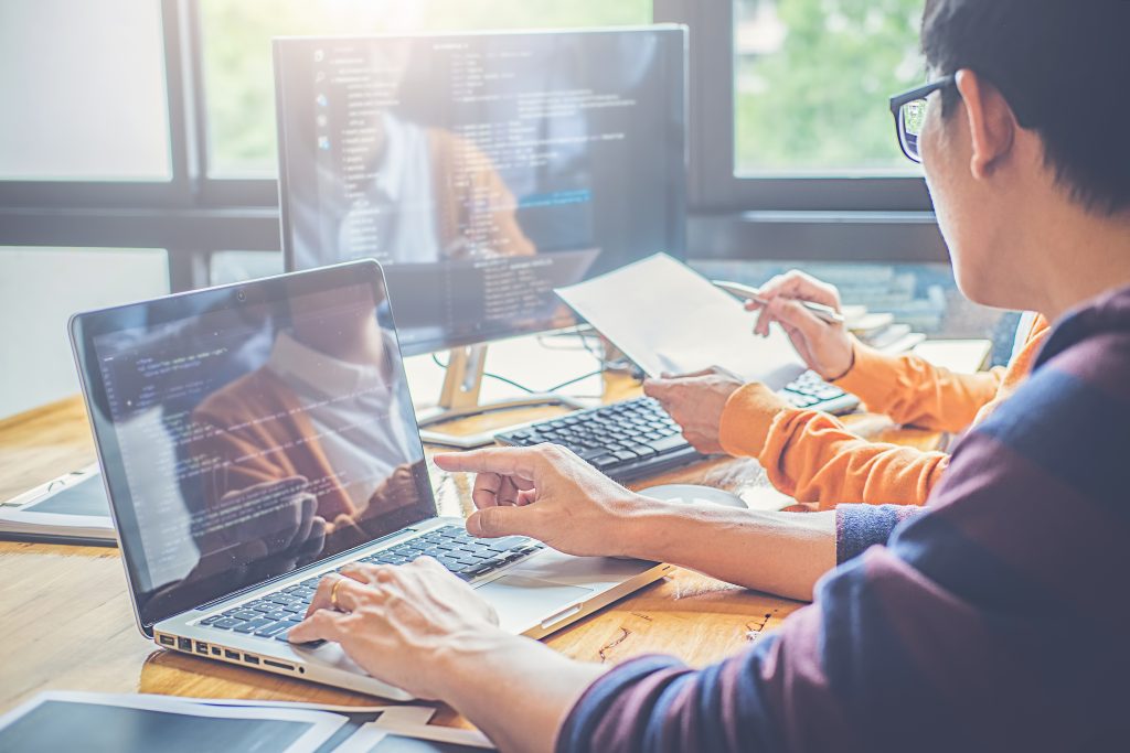 Programmer working in a software development and coding technolo