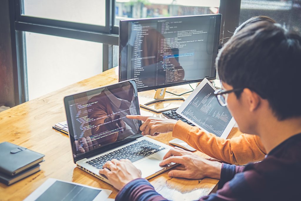 Programmer working in a software development and coding technolo