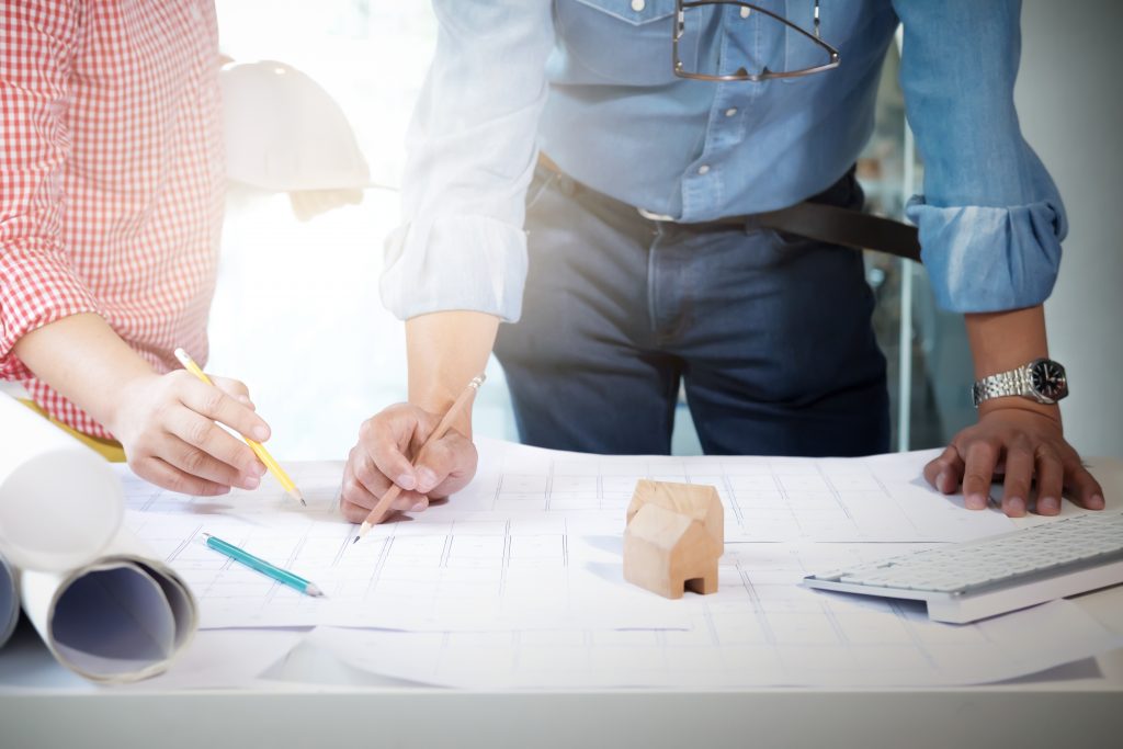 Engineer meeting for architectural project.