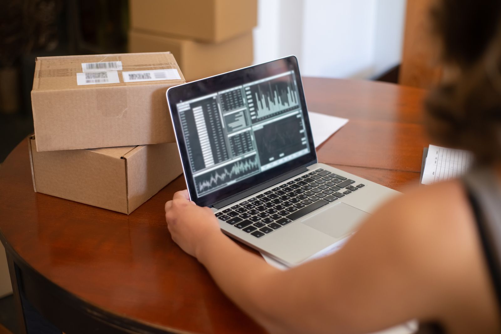 Order fulfilment handled on a laptop, the operator-only admin scope among the disadvantages of Medusa.js