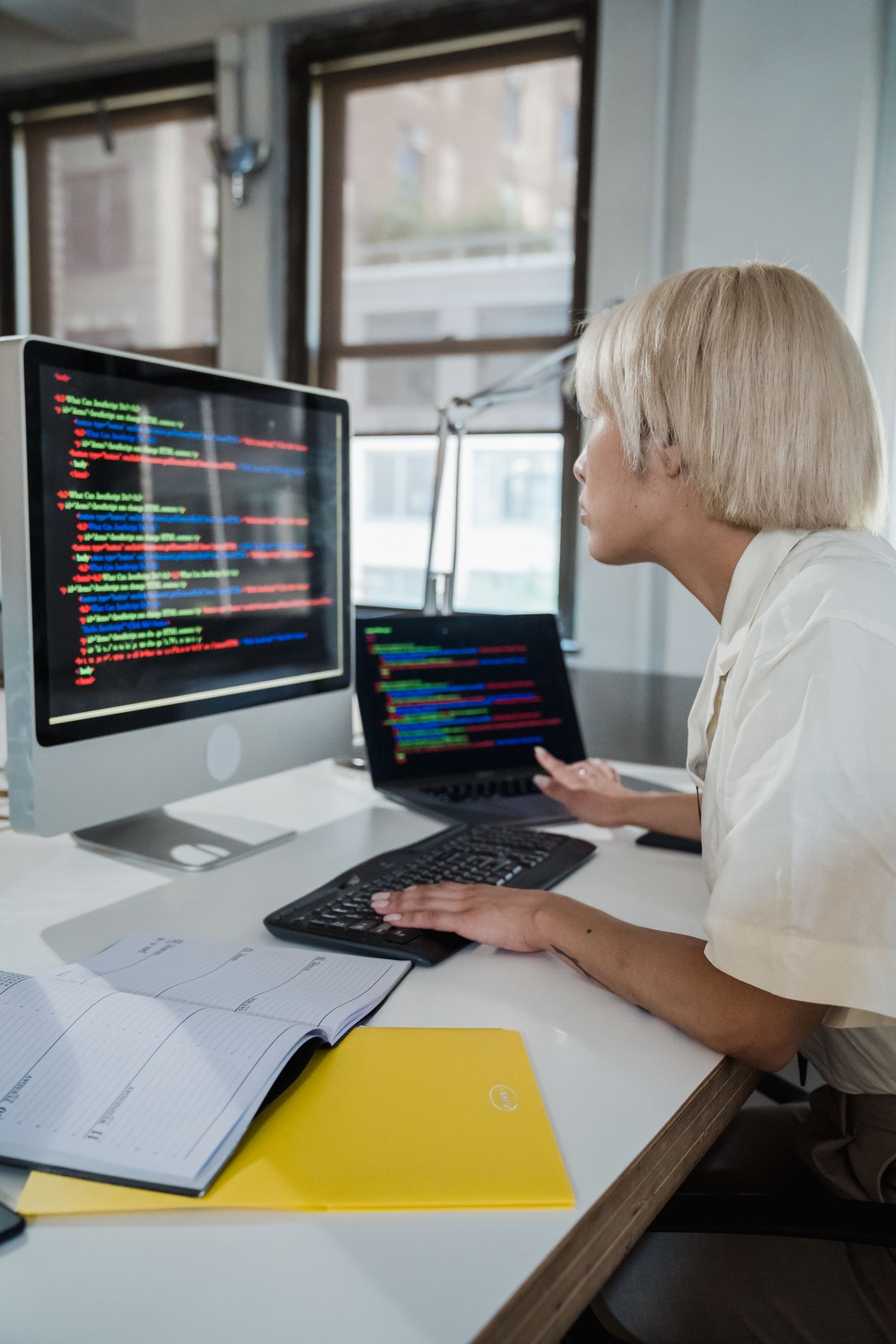 Developer studying module code on screen, the learning curve among the disadvantages of Medusa.js