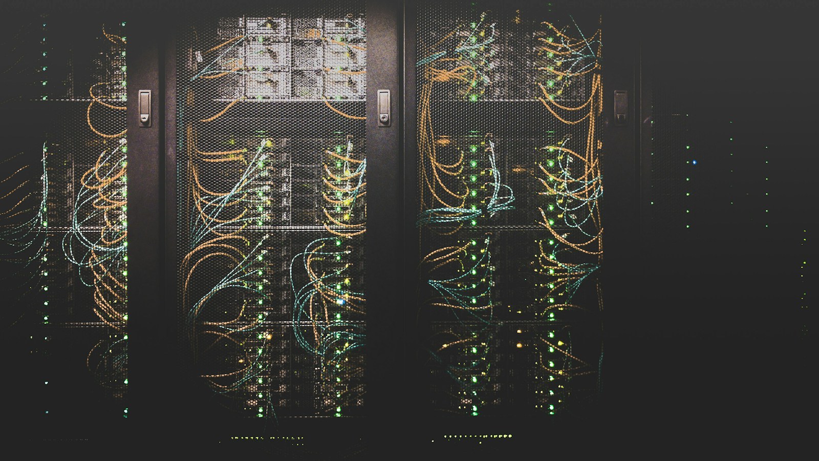 Active server racks with networking cables and status LEDs — data residency and ownership in your own infrastructure