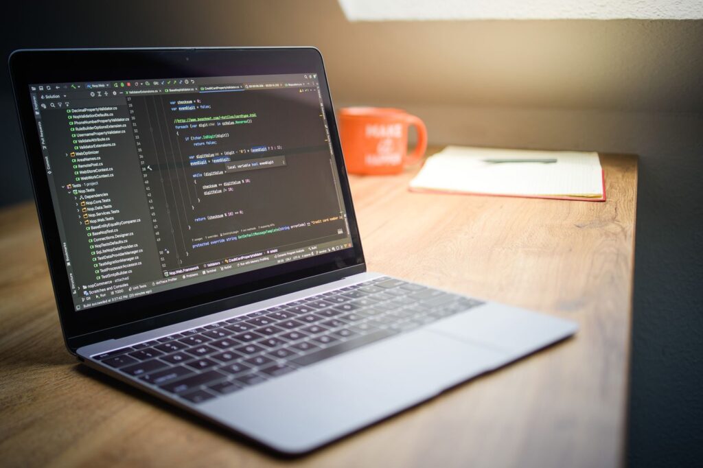 Modern code editor showing developer work with Payload and Strapi