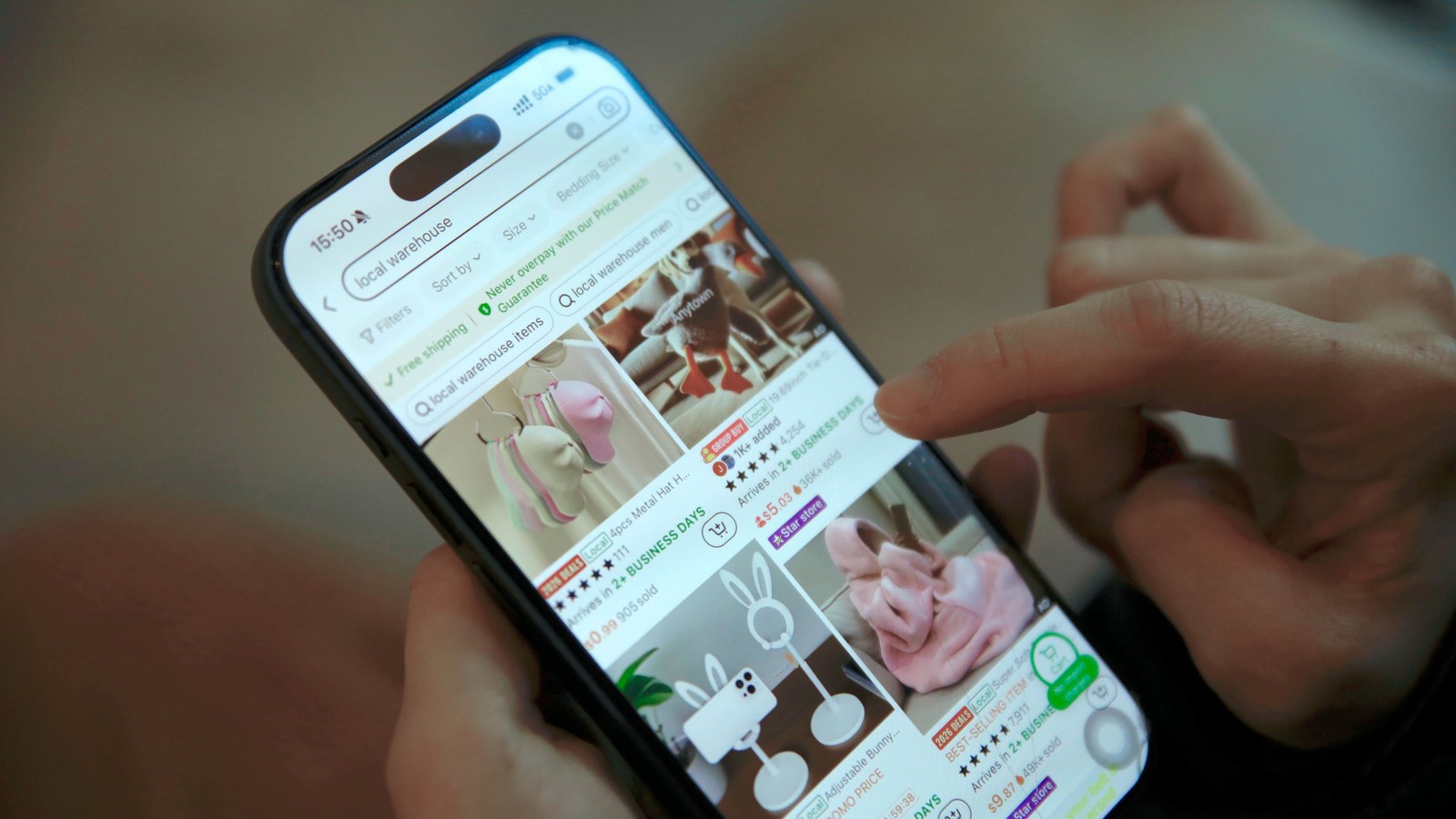 Shopper scrolling a product grid in a mobile shopping app, where segment offers and personal recommendations appear