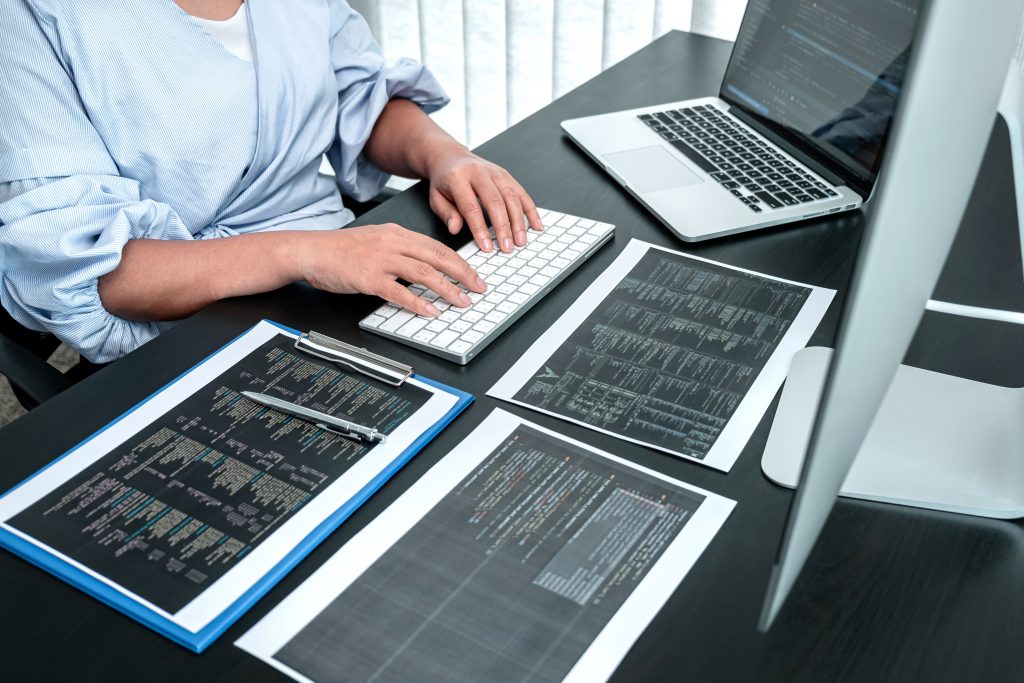 Female Developer programmer working on coding program software c
