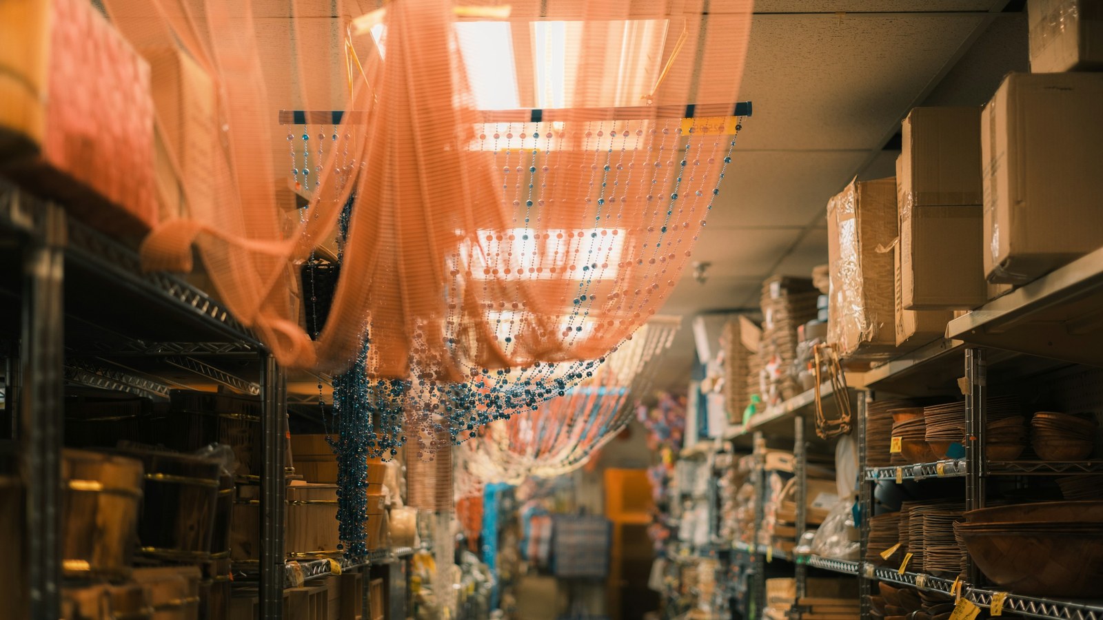 Crowded stockroom shelves packed with boxed merchandise, where physical stock can drift from system counts