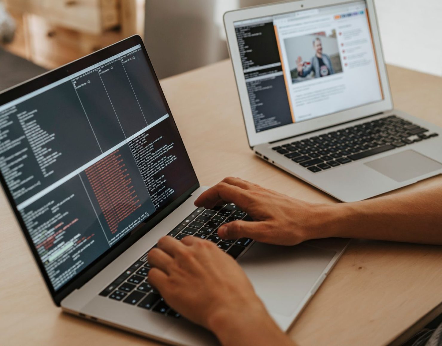 Two laptops side by side comparing custom vs SaaS marketplace platforms