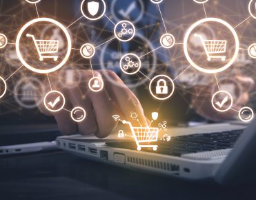 Male hand touching in shopping cart. E commerce. Online shopping