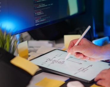 Sketching marketplace architecture components next to a code editor