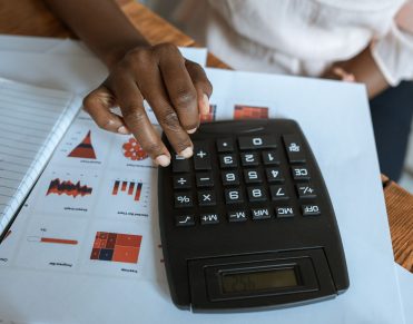 Calculating marketplace development cost using a calculator and financial reports