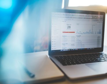 Outgrow no-code marketplace: SaaS growth dashboard on a laptop screen