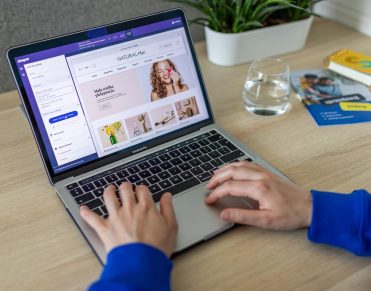 Editor previewing a storefront page on a laptop, the publishing side of a Payload CMS Medusa stack