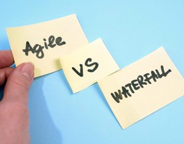 waterfall vs agile paper task on blue background, software devel